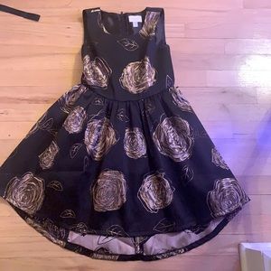 This black dress is formal and feels like silk on the inside.